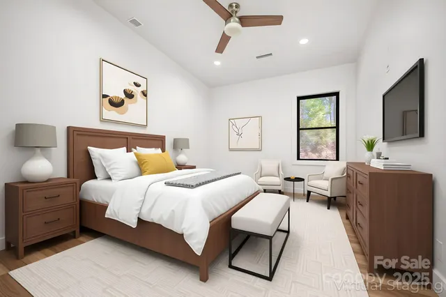 a bedroom with a bed couch and window