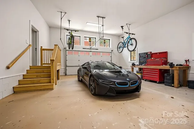 a car park with a bed and white walls