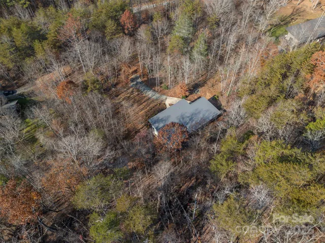a view of a lush green hillside and a building