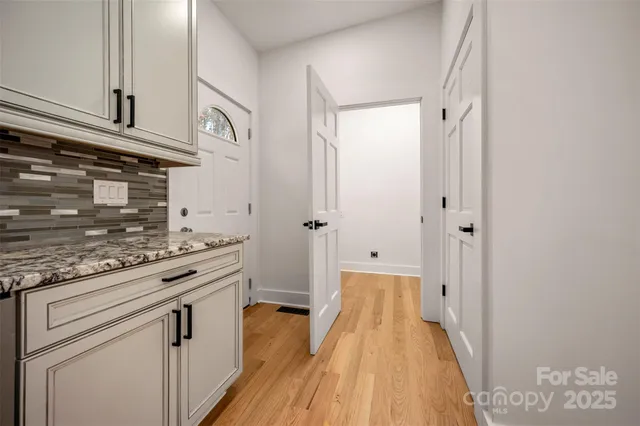 a view of a kitchen from the hallway