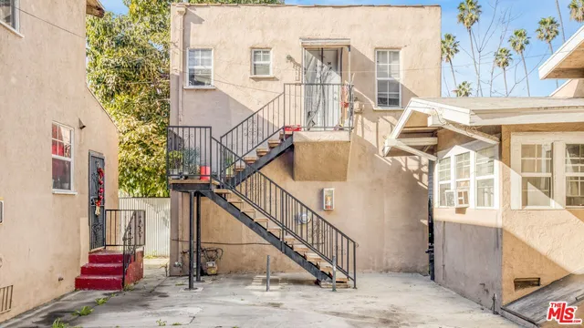 a view of staircase with white walls and windows