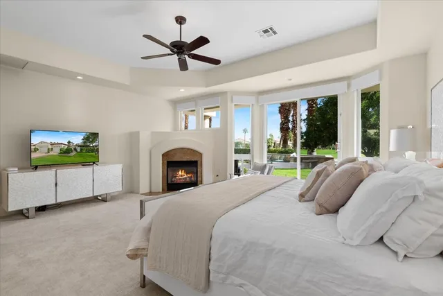 a bedroom with a bed and a fireplace