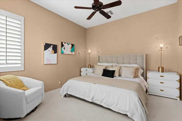 a bedroom with a bed and couch