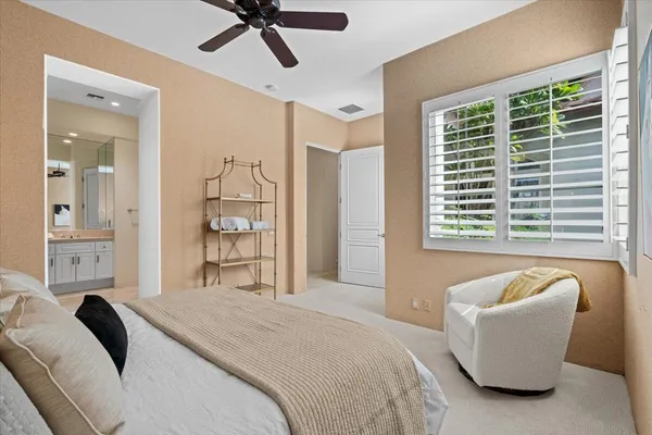a bedroom with a bed furniture and a window