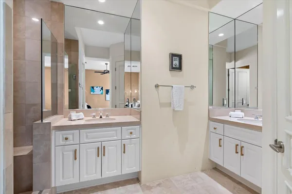 a bathroom with a double vanity sink mirror and double