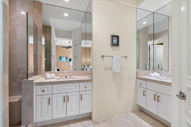 a bathroom with a double vanity sink mirror and double