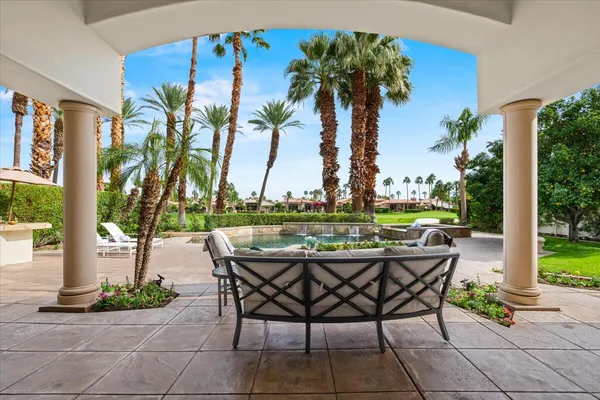 a view of a backyard with a sitting area and furniture