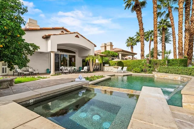 swimming pool view with a outdoor seating