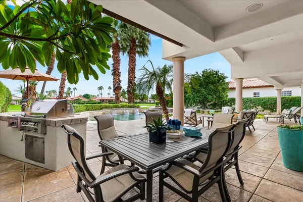 a view of an outdoor space with garden and furniture