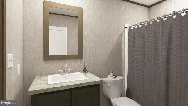 a bathroom with a sink toilet and mirror