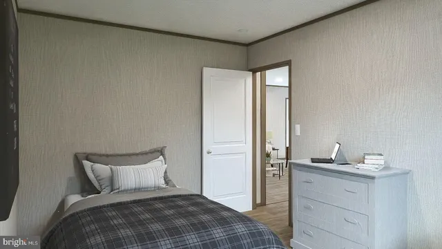 a bedroom with a bed and a dresser