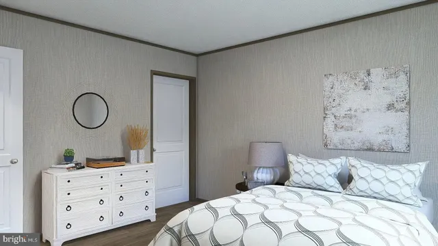 a bedroom with a bed and dresser