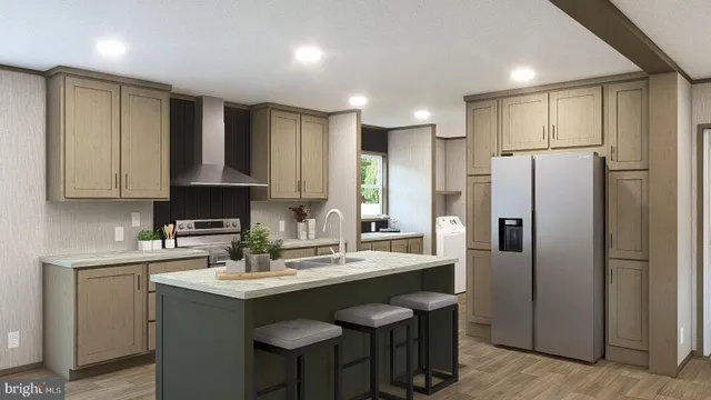 a kitchen with kitchen island granite countertop a sink cabinets and stainless steel appliances