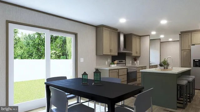 a kitchen with a table chairs sink and cabinets