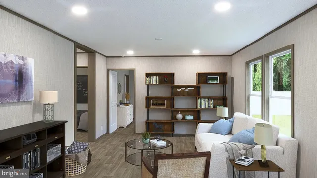 a living room with furniture and a floor to ceiling window