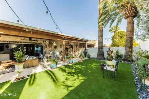 a view of a chairs and table in a patio