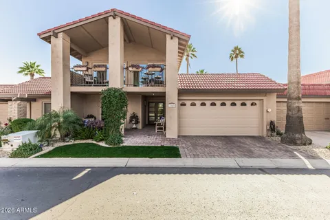 a view of a patio with table and chairs and potted plants