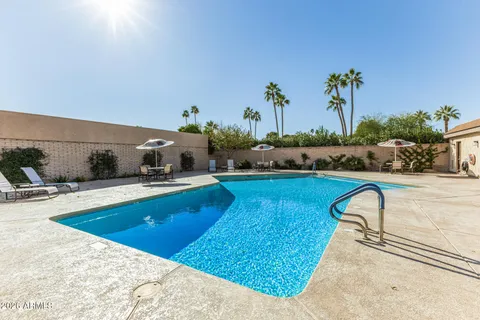a view of a lake with houses in the back