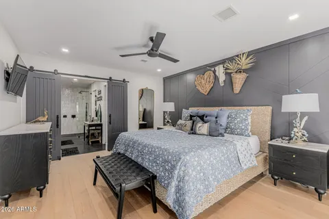 a living room with lots of furniture and kitchen view