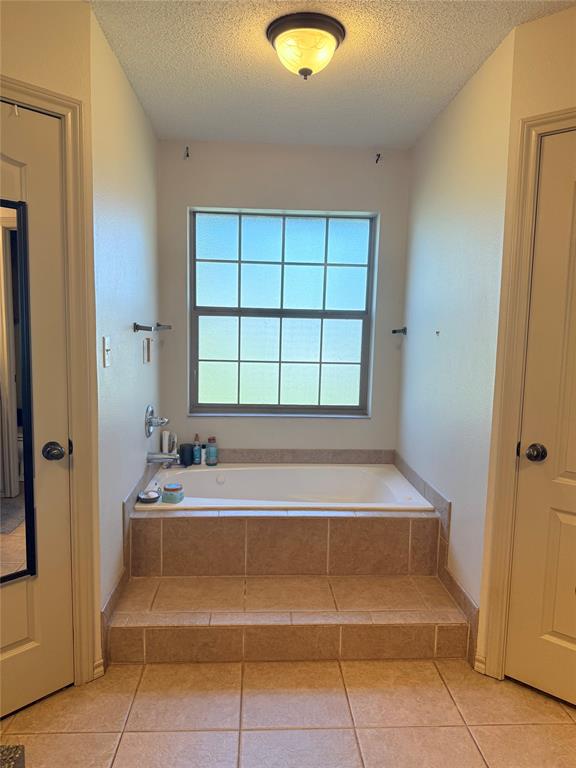 240 County Road Paris, TX 75462 - Photo 13 of 25 a spacious bathroom with a tub and a shower