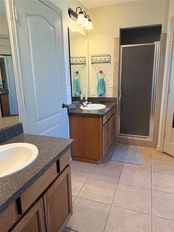 240 County Road Paris, TX 75462 - Photo 14 of 25 a kitchen with granite countertop a sink and a stove