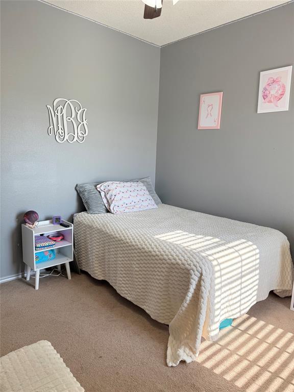 240 County Road Paris, TX 75462 - Photo 19 of 25 a bedroom with a bed and a chair