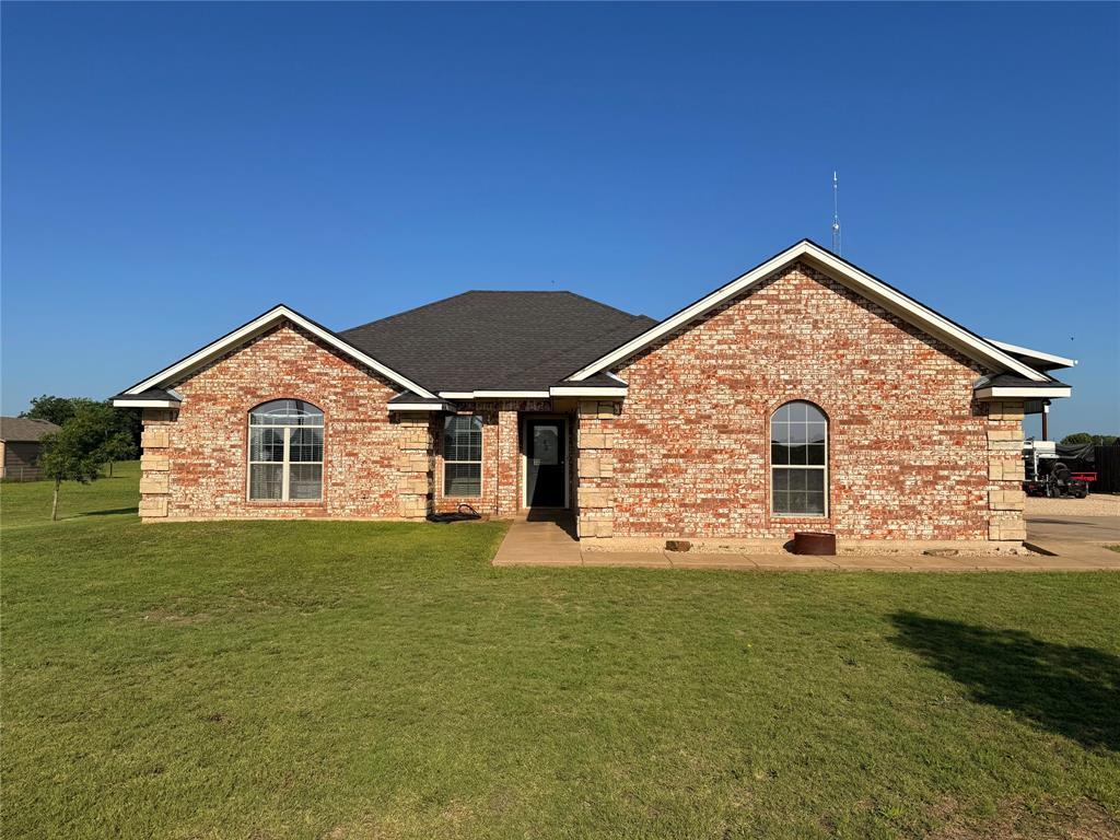240 County Road Paris, TX 75462 - Photo 2 of 25 a view of a house with a yard