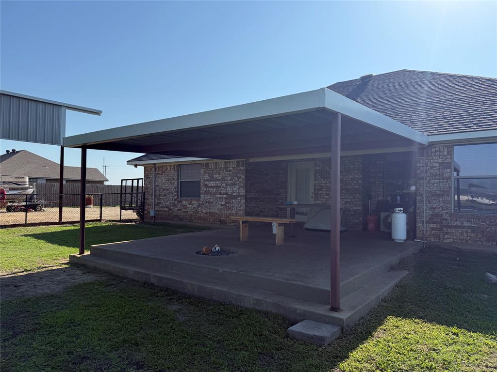 240 County Road Paris, TX 75462 - Photo 21 of 25 a backyard of a house with table and chairs
