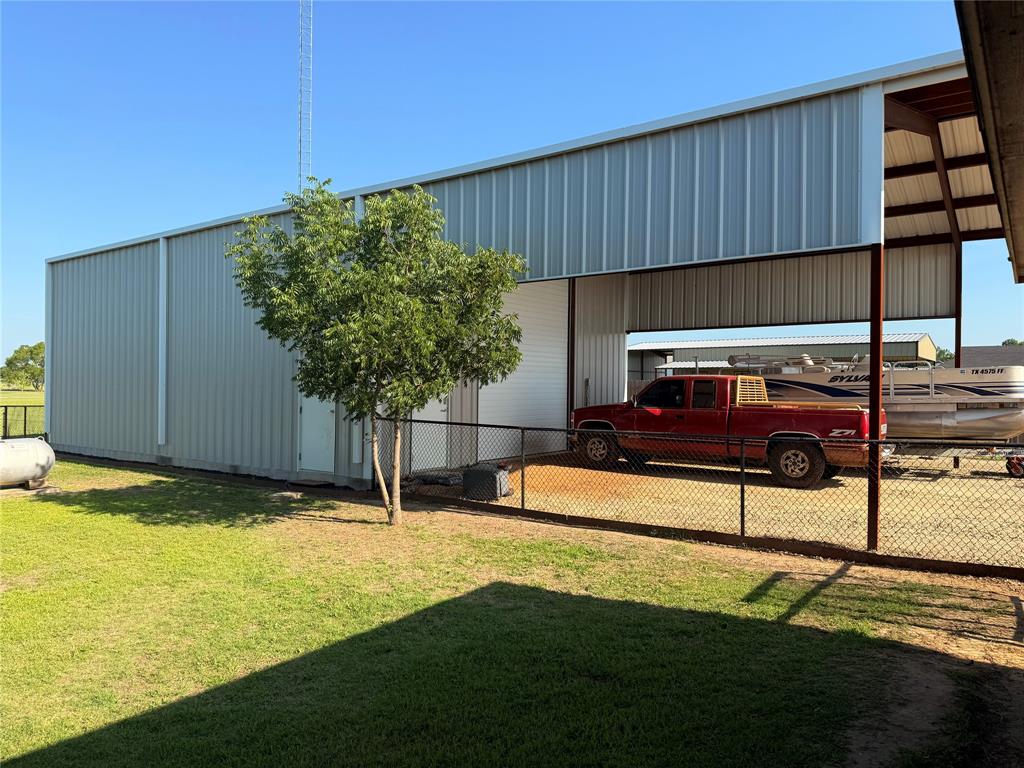 240 County Road Paris, TX 75462 - Photo 22 of 25 a backyard of a house with table and chairs