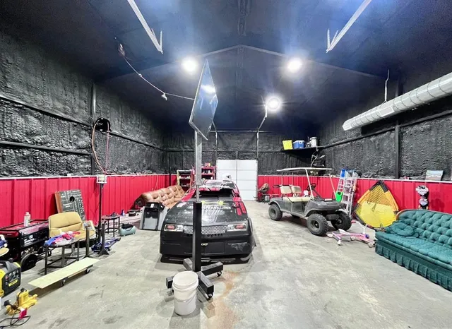 a view of parking garage with cars