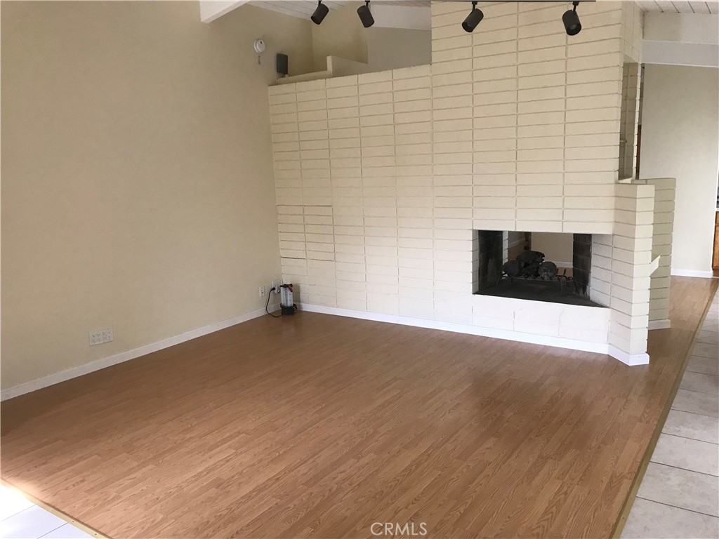 519 Santa Maria Road Arcadia, CA 91007 - Photo 5 of 10 Fireplace between living room and Family room