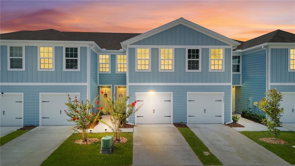 12003 Grizzly Lane New Port Richey, FL 34654 - Photo 1 of 43 front view of house with a yard