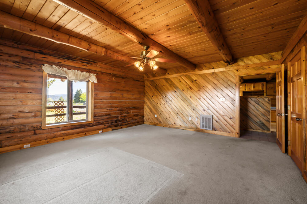 34840 Dawn Loop Chiloquin, OR 97624 - Photo 50 of 91 a view of an empty room with a fireplace and windows