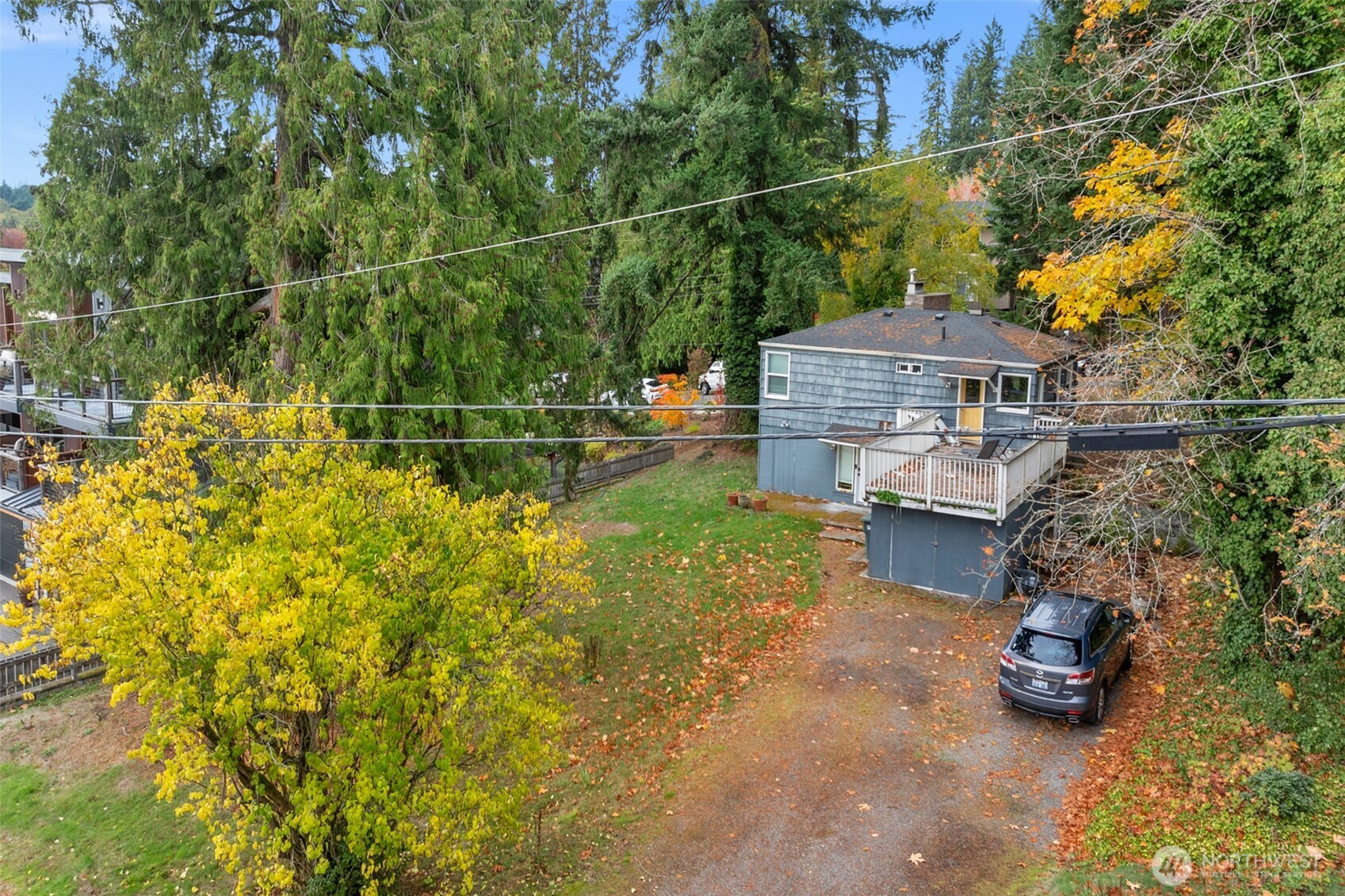 10335 Northeast 189th Street Bothell, WA 98011 - Photo 5 of 11 a backyard of a house with table and chairs