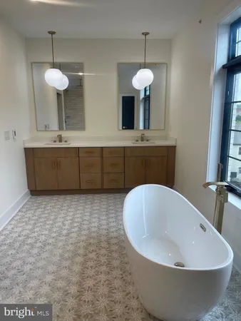 a bathroom with a bathtub and a sink
