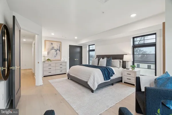 a bedroom with a large bed and a window