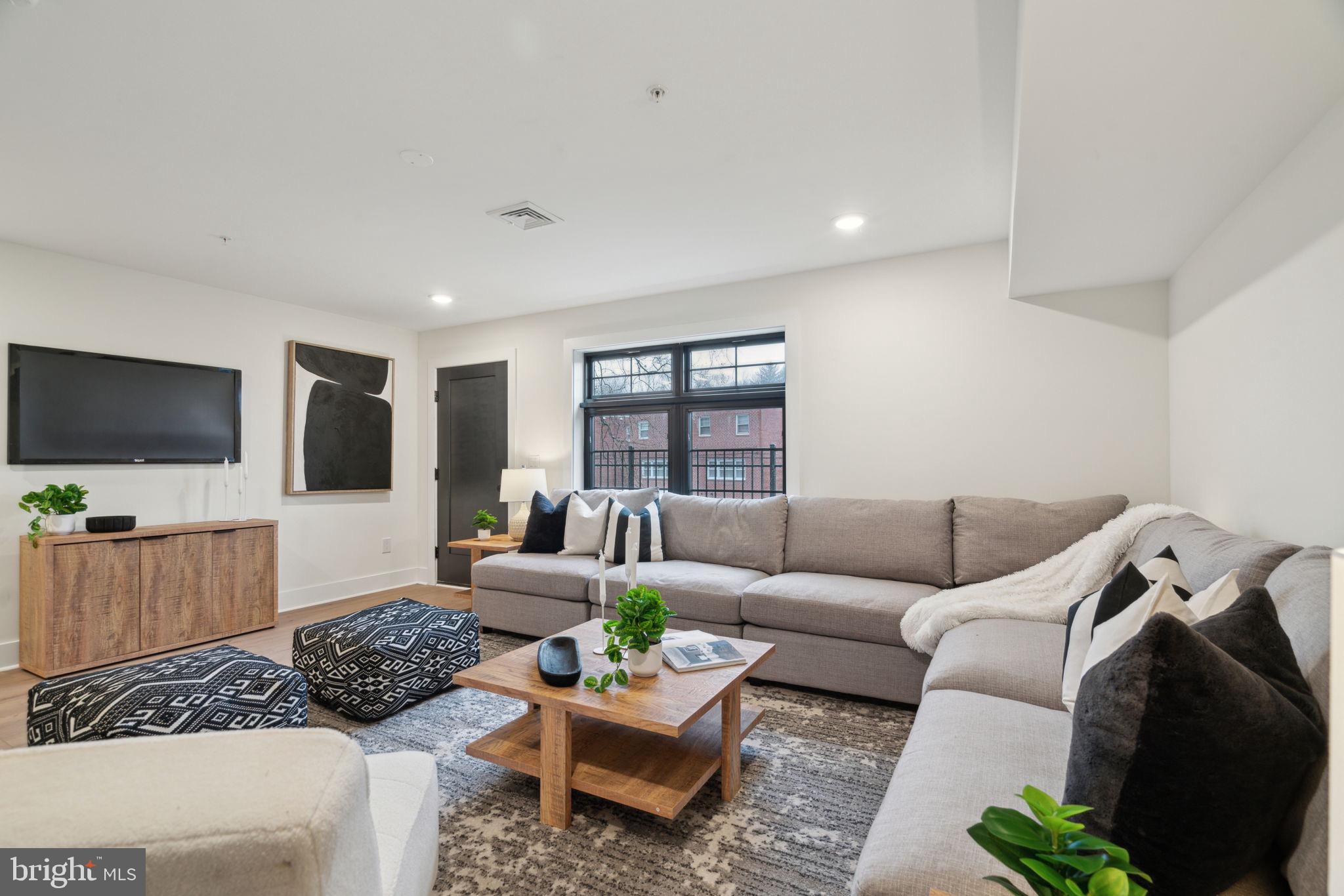 7519 Ridge Avenue Philadelphia, PA 19128 - Photo 24 of 26 a living room with furniture and a flat screen tv