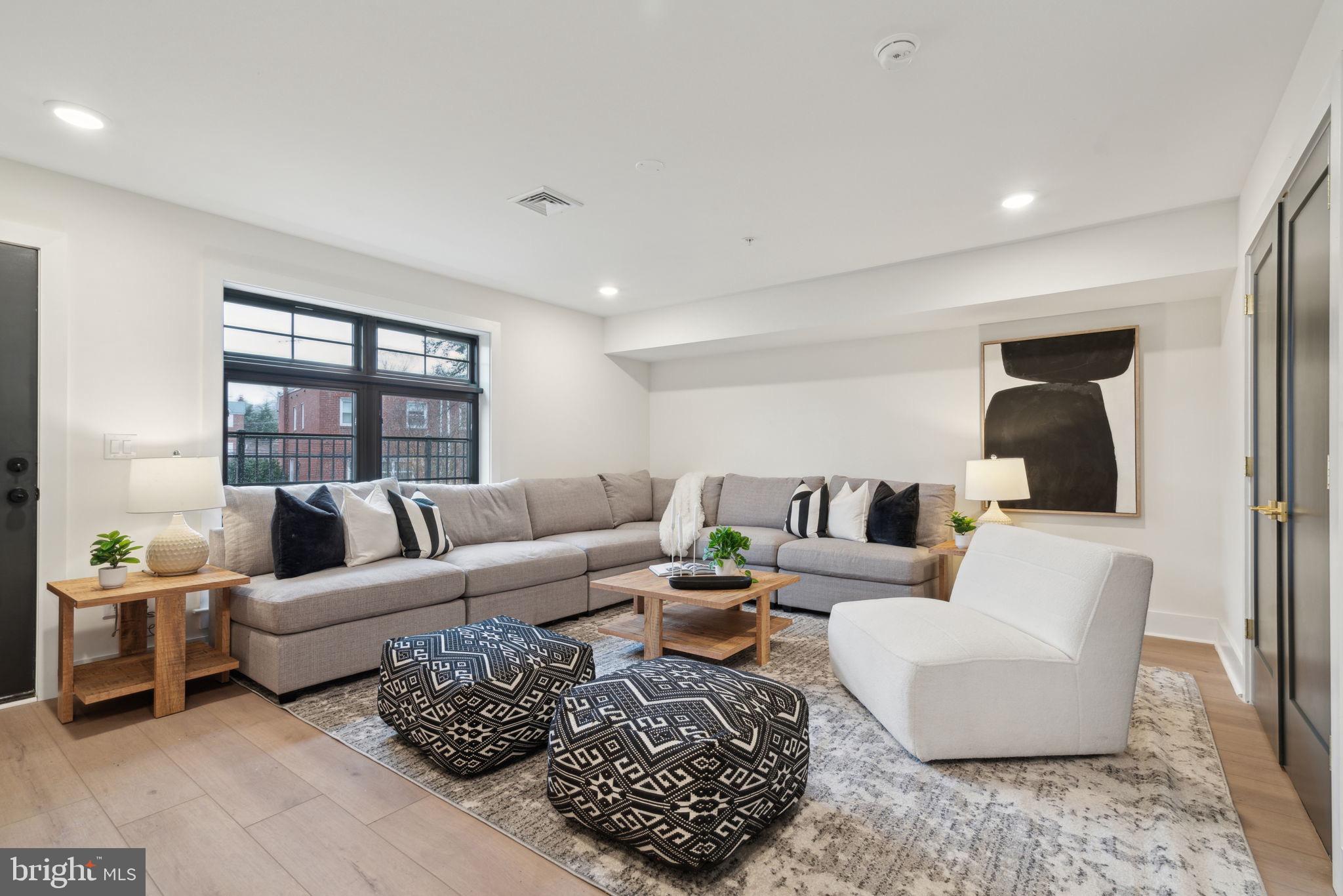 7519 Ridge Avenue Philadelphia, PA 19128 - Photo 25 of 26 a living room with furniture and a large window