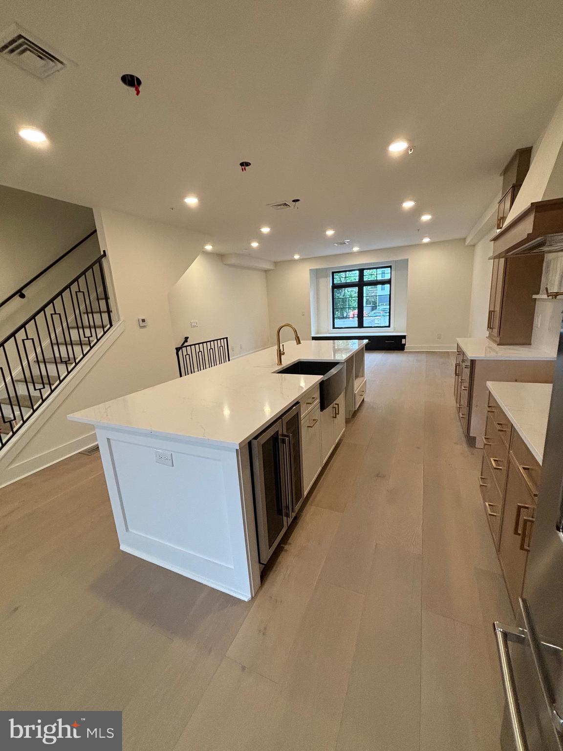 7519 Ridge Avenue Philadelphia, PA 19128 - Photo 7 of 26 a large kitchen with stainless steel appliances a large counter top