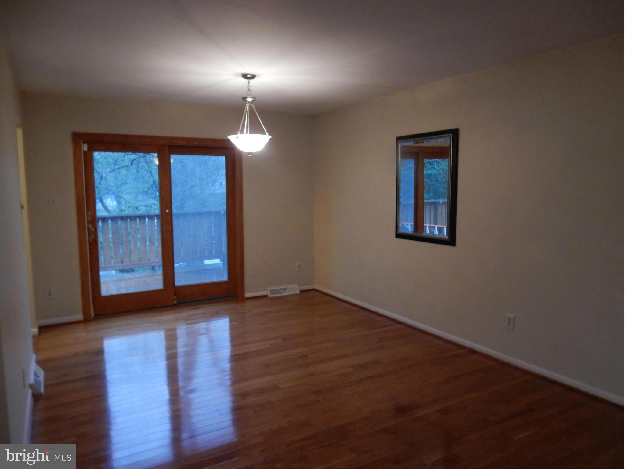 508 Tulip Road Riva, MD 21140 - Photo 11 of 27 Dining Room and Sliders to Rear Deck