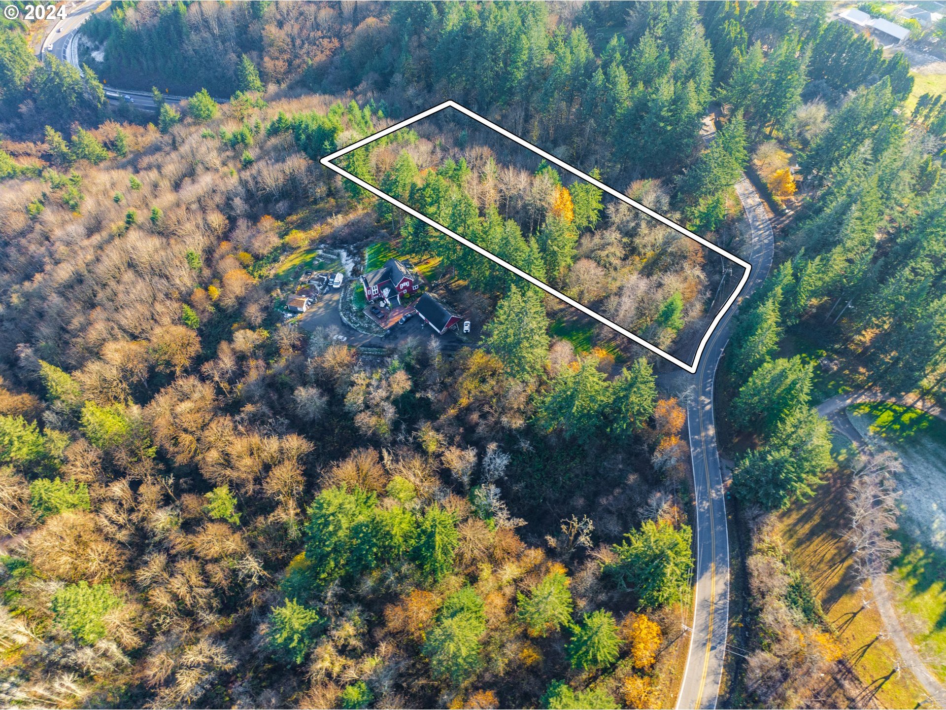 Northwest Skyline Boulevard Portland, OR 97231 - Photo 18 of 24 a backyard of a house with lots of green space and garden