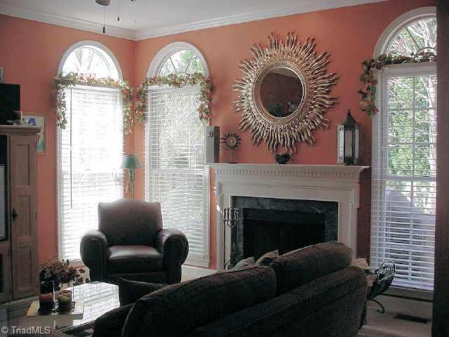 6300 High View Road Greensboro, NC 27410 - Photo 9 of 9 Other. What a beautiful room, with gas log starter in the fireplace, arched windows and an arched opening to the kitchen.