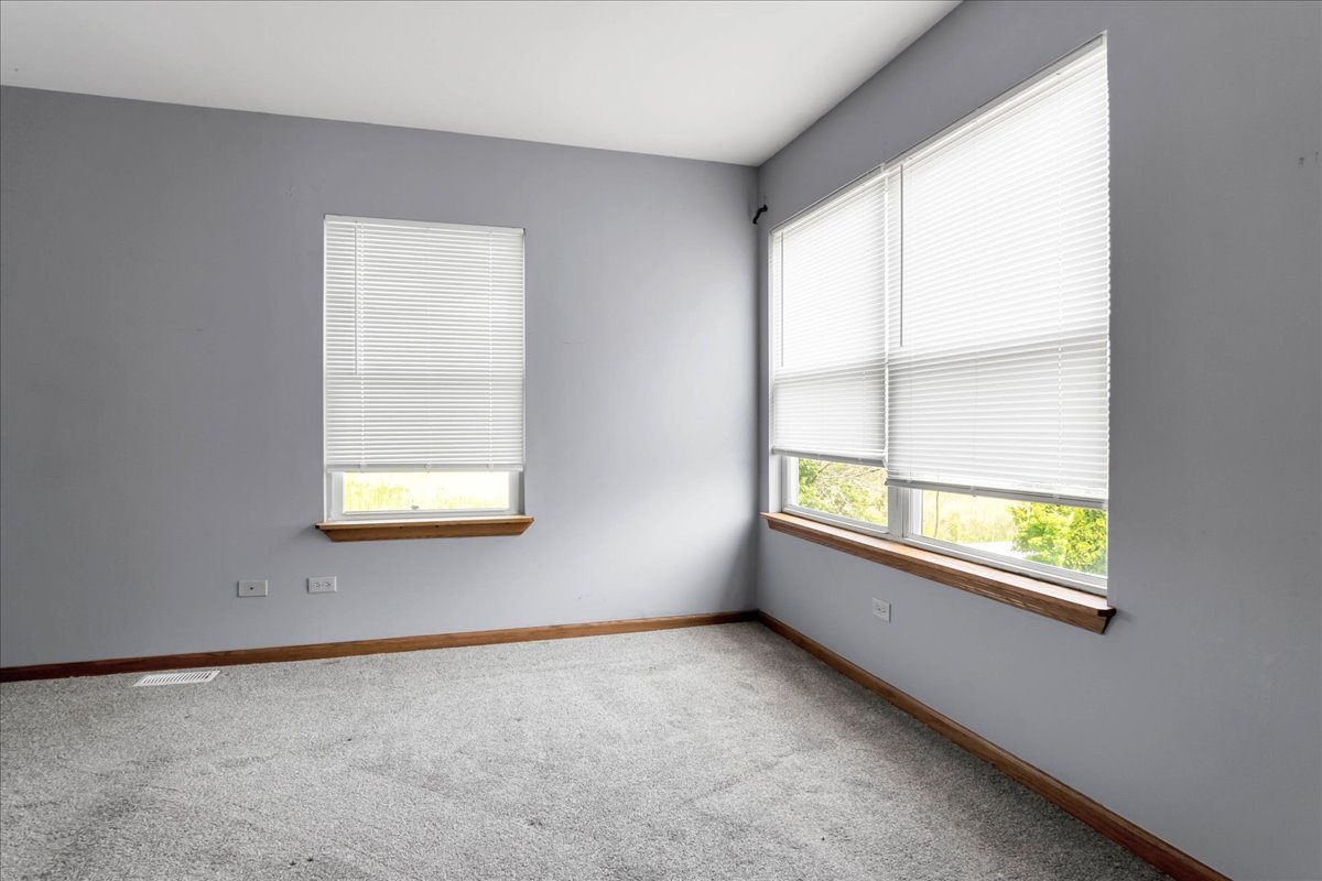 2029 Ridgemoor Drive Plainfield, IL 60586 - Photo 15 of 26 an empty room with windows