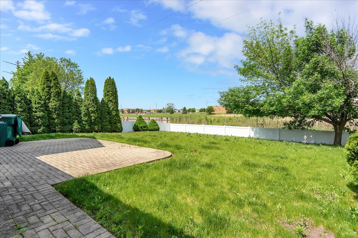 2029 Ridgemoor Drive Plainfield, IL 60586 - Photo 25 of 26 a view of a yard with palm trees