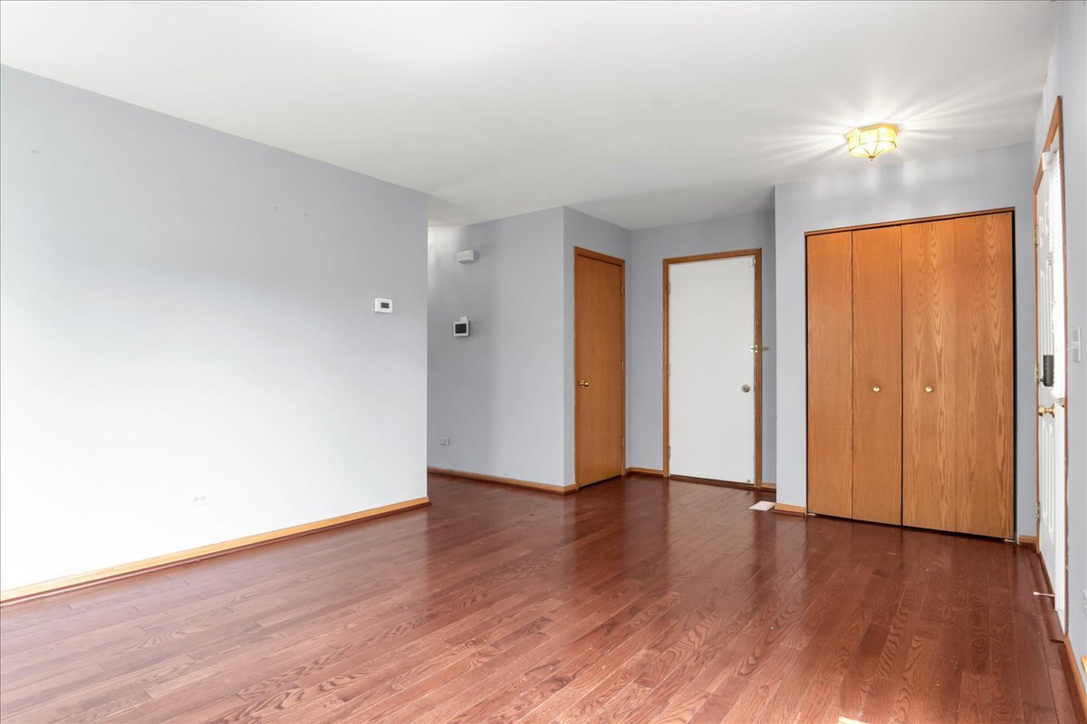 2029 Ridgemoor Drive Plainfield, IL 60586 - Photo 4 of 26 a view of an empty room with wooden floor
