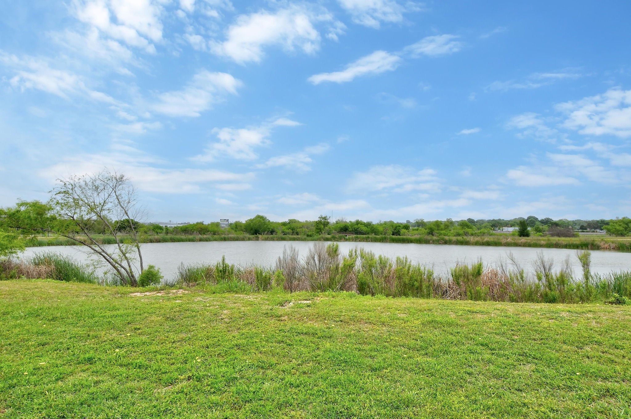 877 Hot Spring Valley Buda, TX 78610 - Photo 35 of 36 a view of a lake with houses in the back