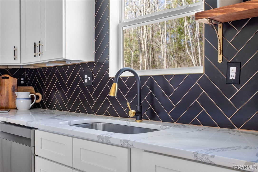 8011 Courthouse Road Providence Forge, VA 23140 - Photo 13 of 29 Kitchen featuring backsplash, a sink, white cabine