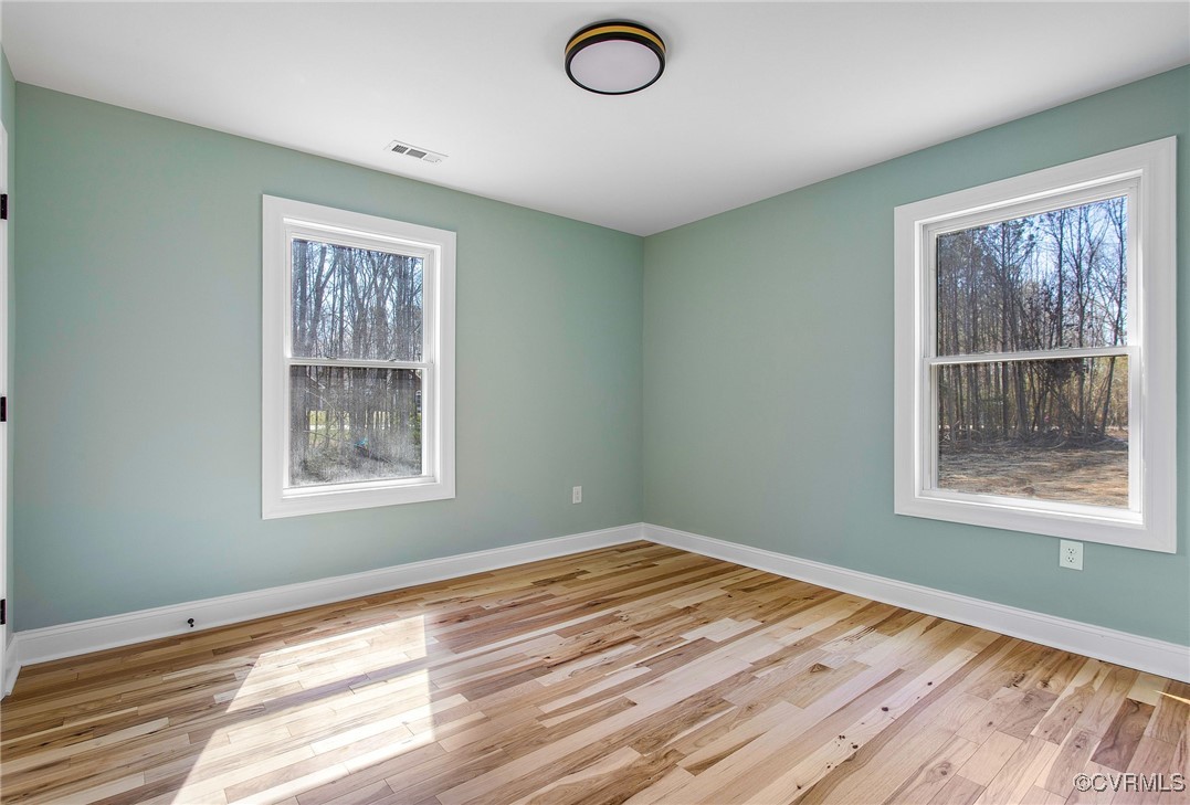 8011 Courthouse Road Providence Forge, VA 23140 - Photo 22 of 29 Unfurnished room with wood finished floors, basebo