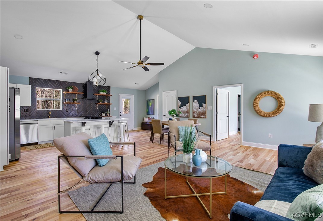 8011 Courthouse Road Providence Forge, VA 23140 - Photo 7 of 29 Living area featuring high vaulted ceiling, basebo
