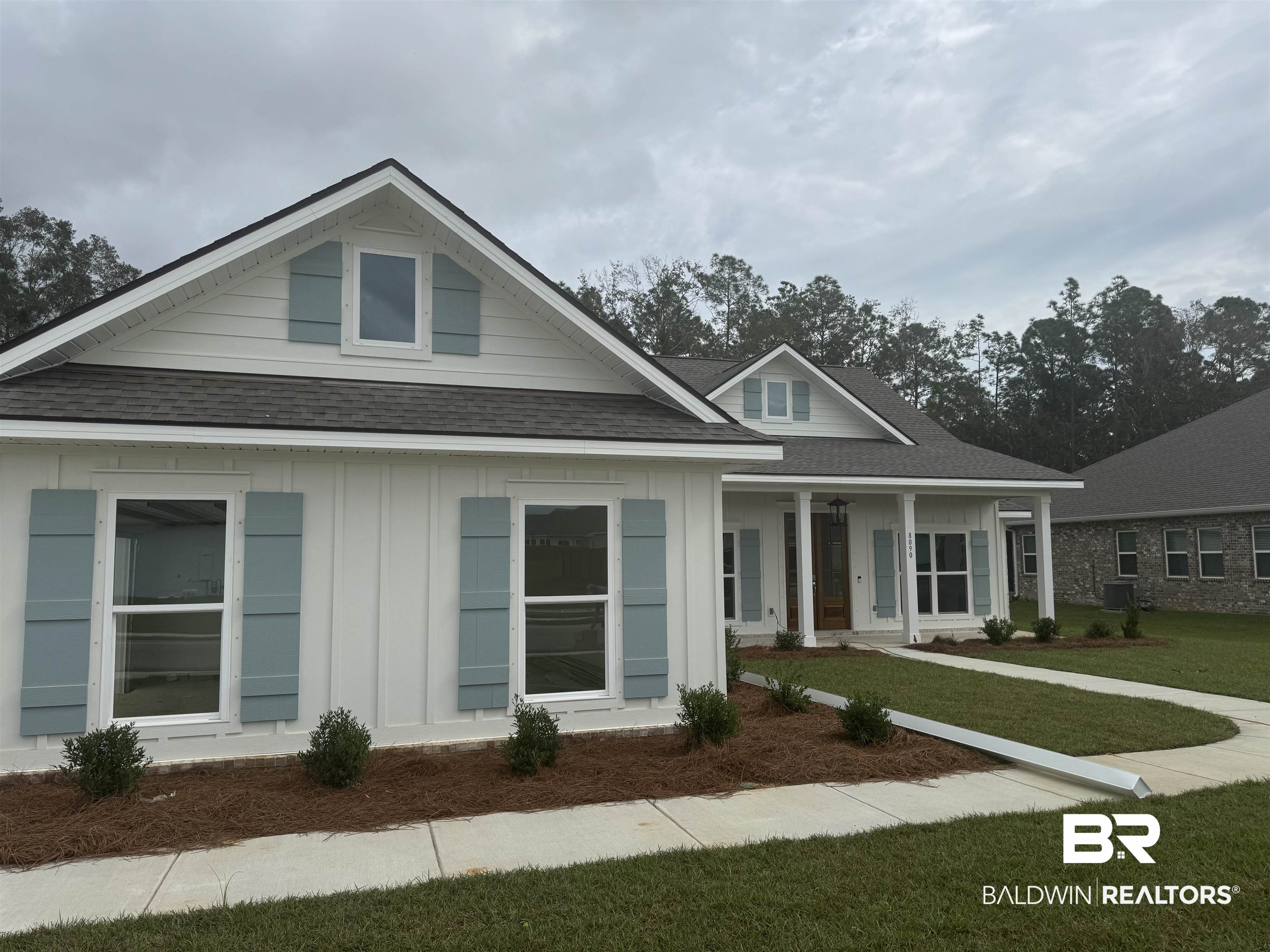 8090 Calverton Street, Unit 23 Foley, AL 36535 - Photo 2 of 30 View of front of property featuring cooling unit and a front yard